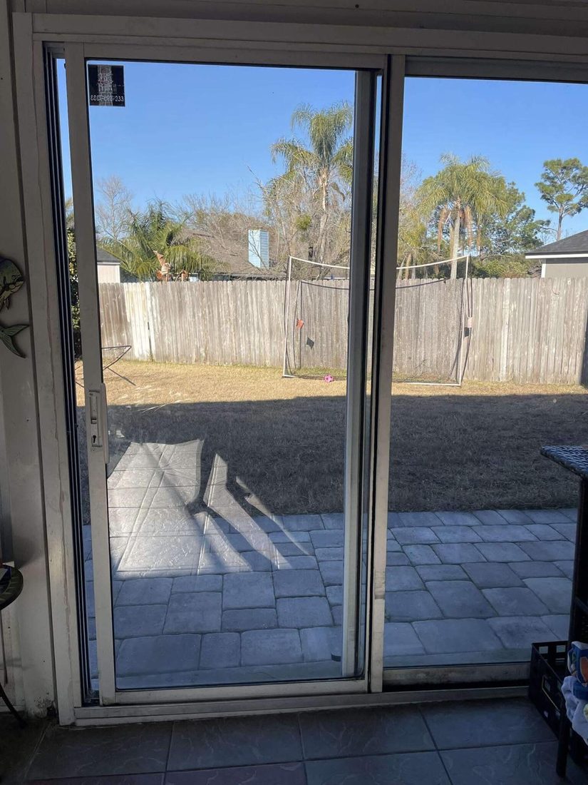 Repaired sliding door opening to a backyard