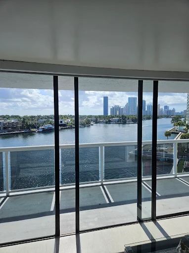 High-rise condo sliding glass door overlooking the waterway